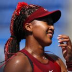 Ariake Tennis Park - Tokyo, Japan - July 25, 2021. Naomi Osaka of Japan celebrates after winning her first round match against Zheng Saisai of China