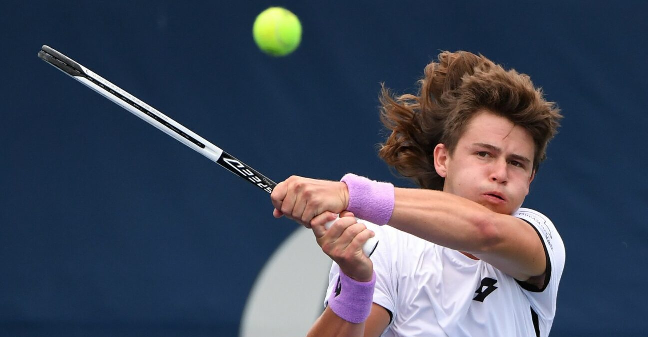 J.J. Wolf of the United States plays a shot against Frances Tiafoe of the United States in first round qualifying play for the National Bank Open at the Aviva Centre.