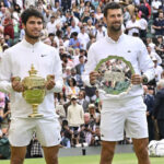 Carlos Alcaraz and Novak Djokovic during the trophy presentation at Wimbledon 2023