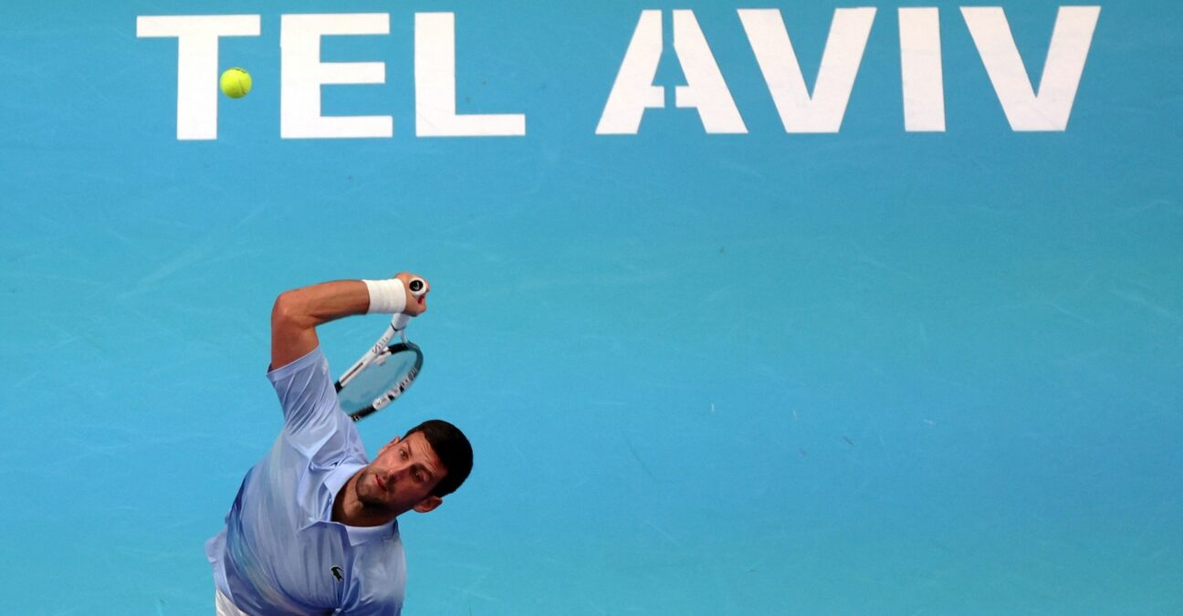 Novak Djokovic hitting a serve in Tel Aviv in 2022